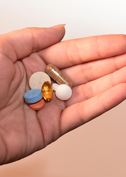 Canva - Person Holding Medication Pill and Capsules.png